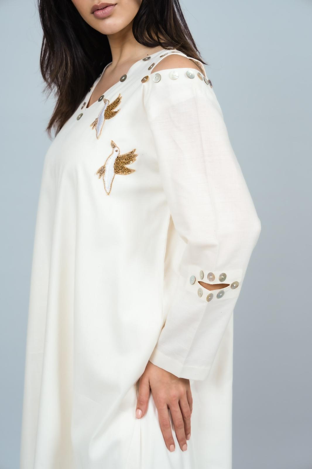 Bird and mother of pearl dress